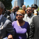 Lesley McSpadden (center), the mother of slain teenager Michael Brown, arrives for a press conference with the Rev. Al Sharpton (left) Aug. 12, 2014, in St. Louis.
Scott Olson/Getty Images